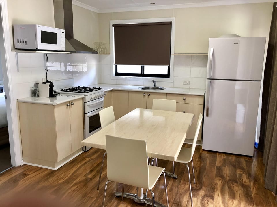 Two Bedroom Deluxe Cabin | Private kitchen | Full-size fridge, microwave, stovetop, toaster