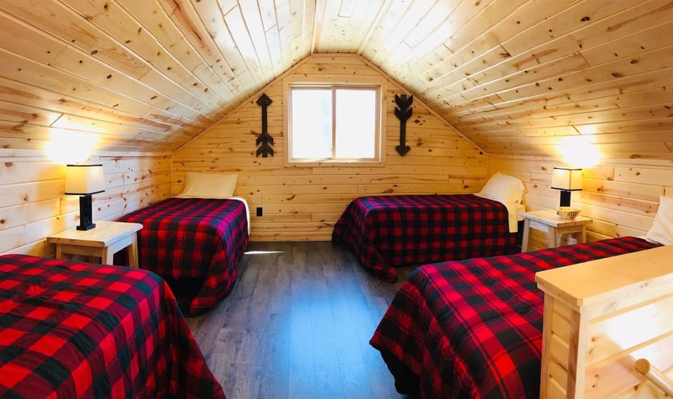 The kids can sleep up in the loft.  They will love it up there! It's an open loft. 
