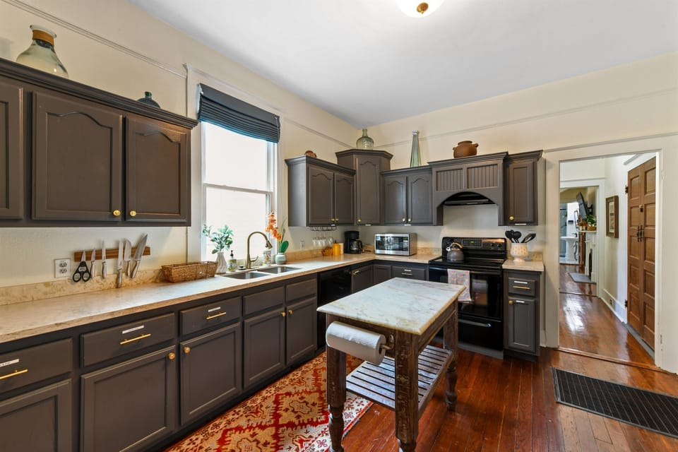 Kitchen - stocked with coffee maker, filters, beans, and grinder, plus everything you need to cook a meal at home.