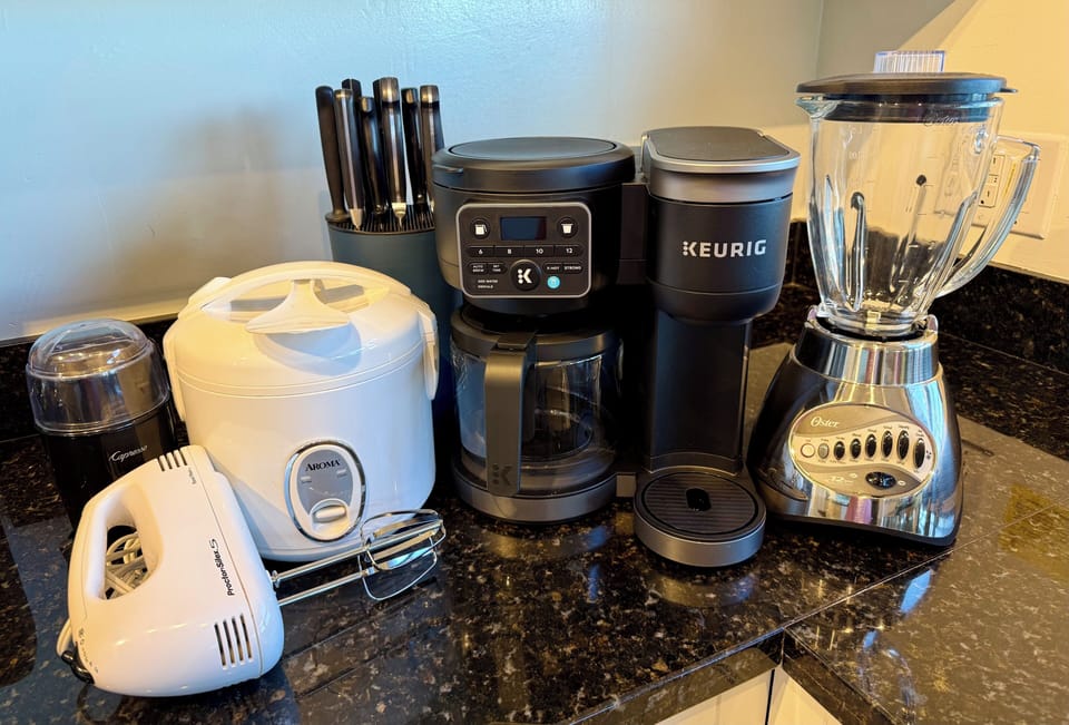 Some of the many appliances available in our fully stocked kitchen. Dual Keurig.