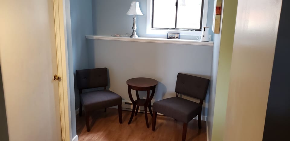 Entryway with bistro set (new floors coming soon)