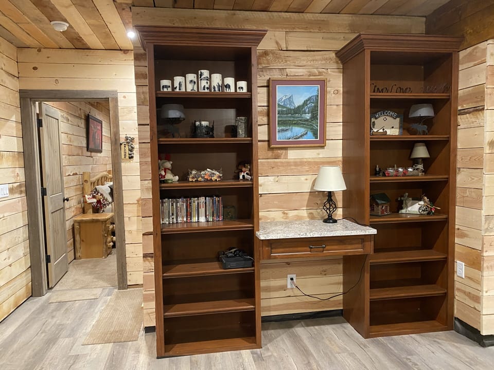 Lower level Family Room, Desk, Bookshelves DVDs, Books, Large TV, kitchenet