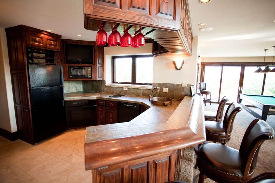 1st floor/2nd kitchen with sink, oven, microwave, and refrigerator.  