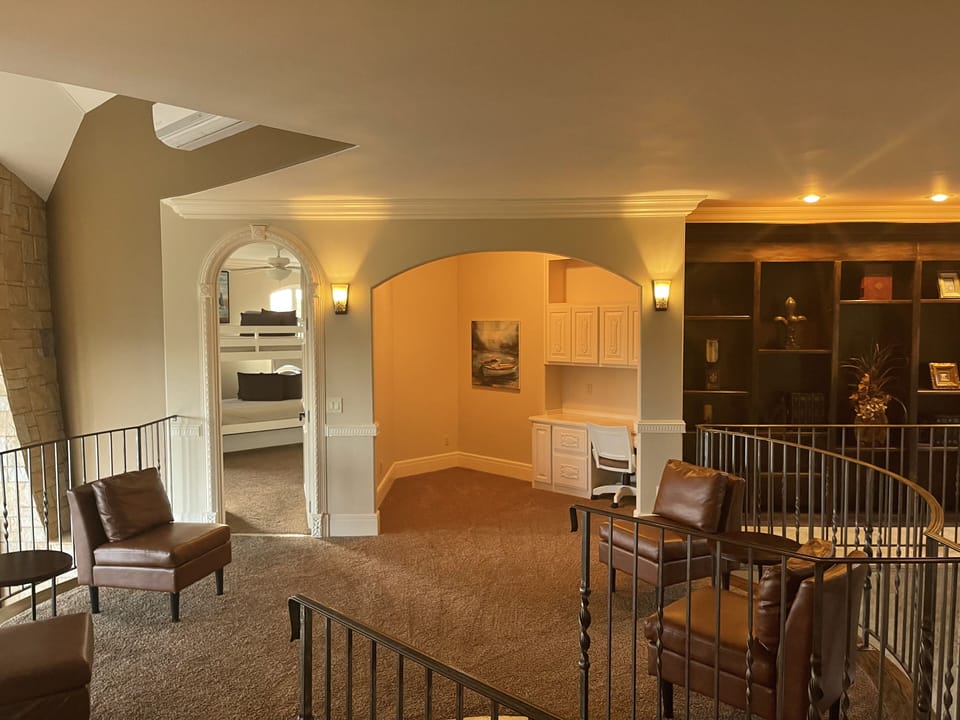 Sitting area/library on fourth floor with views of the lake and golf course