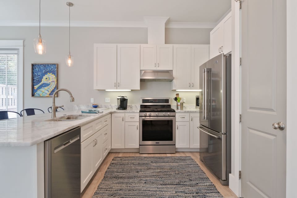 Enjoy the designer kitchen, or for the outdoor chef, patio w/ gas grill, dining