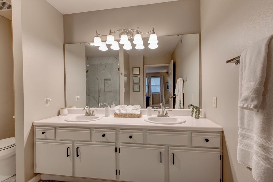 Updated master bath with marble walk-in shower and double-sinks