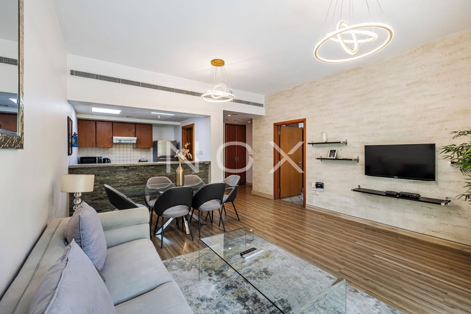 DHH - Secluded Yet Modern 1 Bed Al Alka The Greens | Living area | 42-inch LCD TV with cable channels, TV
