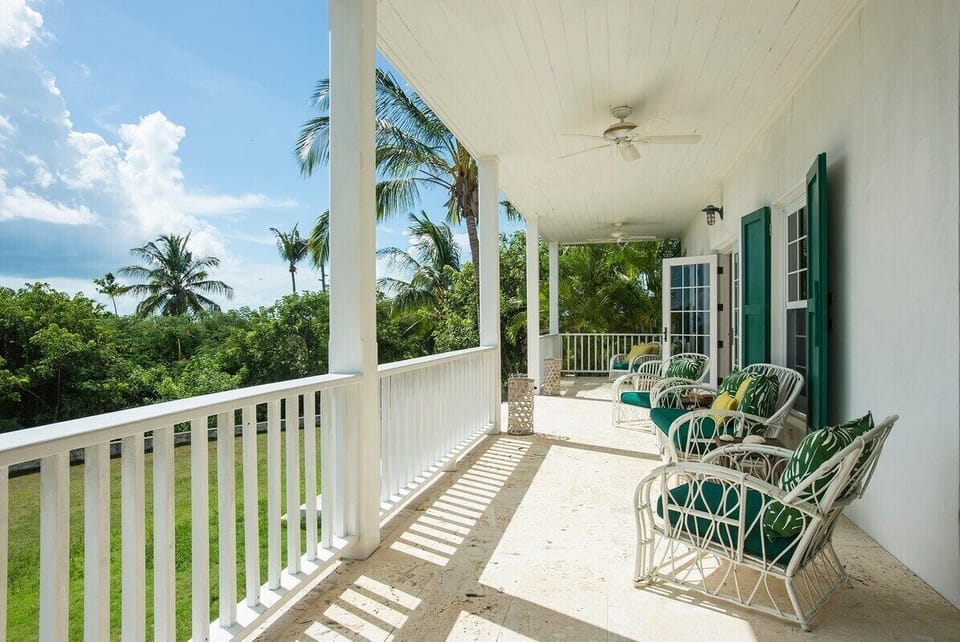 Covered veranda overlooking the lawn.