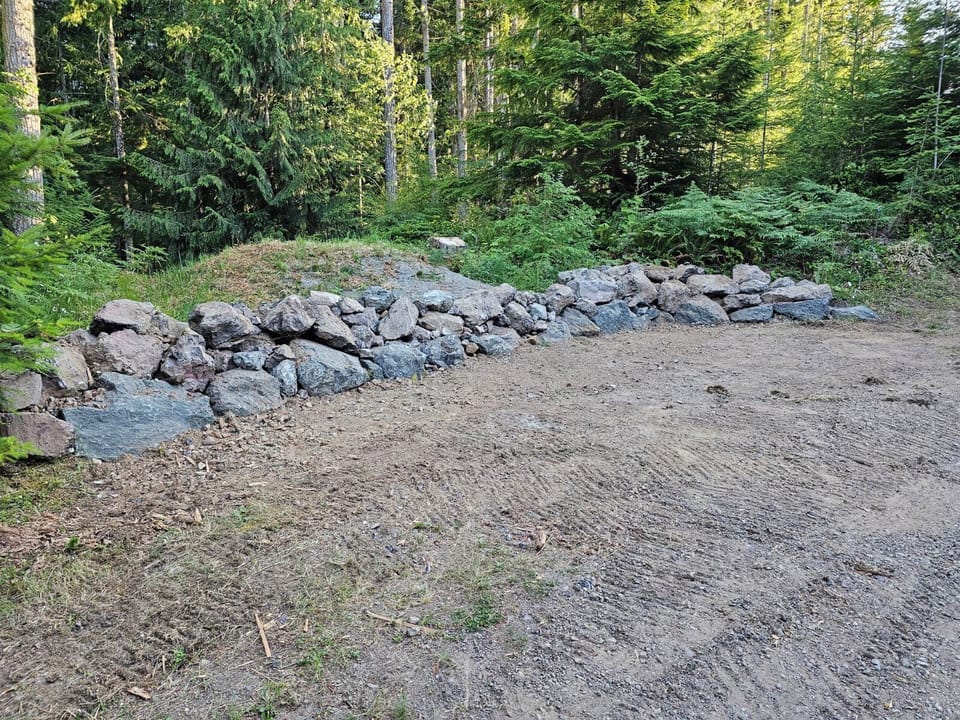 Parking area above property and before gate.