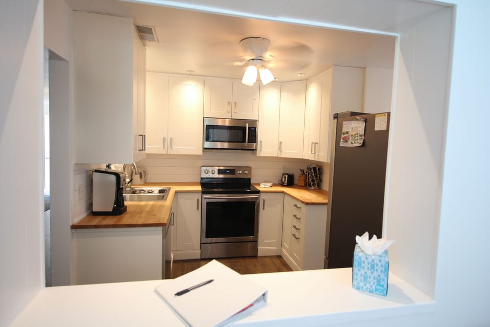 View of the kitchen from the Florida Room through the window.