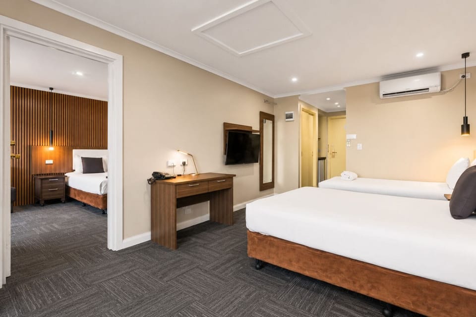 Two Bedroom Family Suite | Bathroom | Shower, designer toiletries, hair dryer, towels