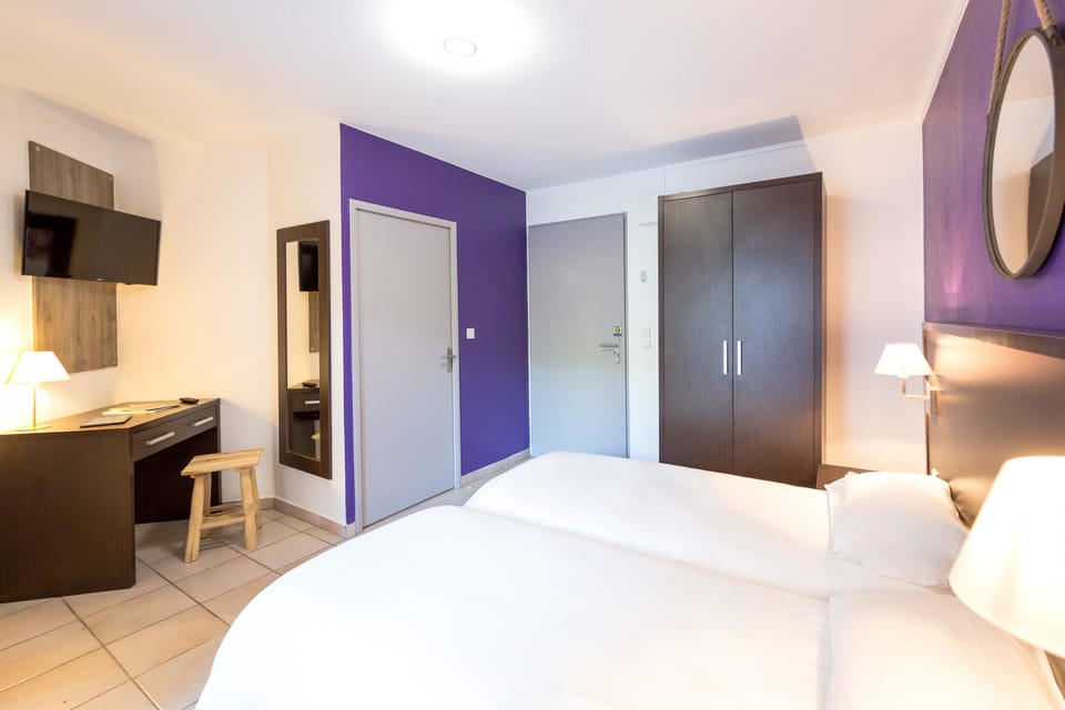 Twin Room | Desk, blackout drapes, iron/ironing board, bed sheets