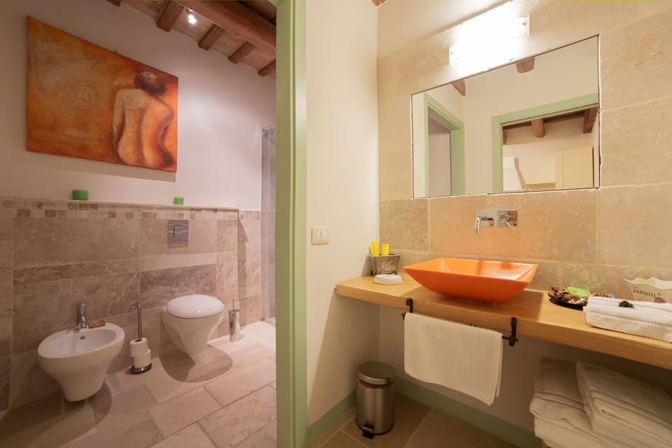 Deluxe Apartment, Patio, Garden View (Clarissa) | Bathroom | Free toiletries, hair dryer, slippers, bidet