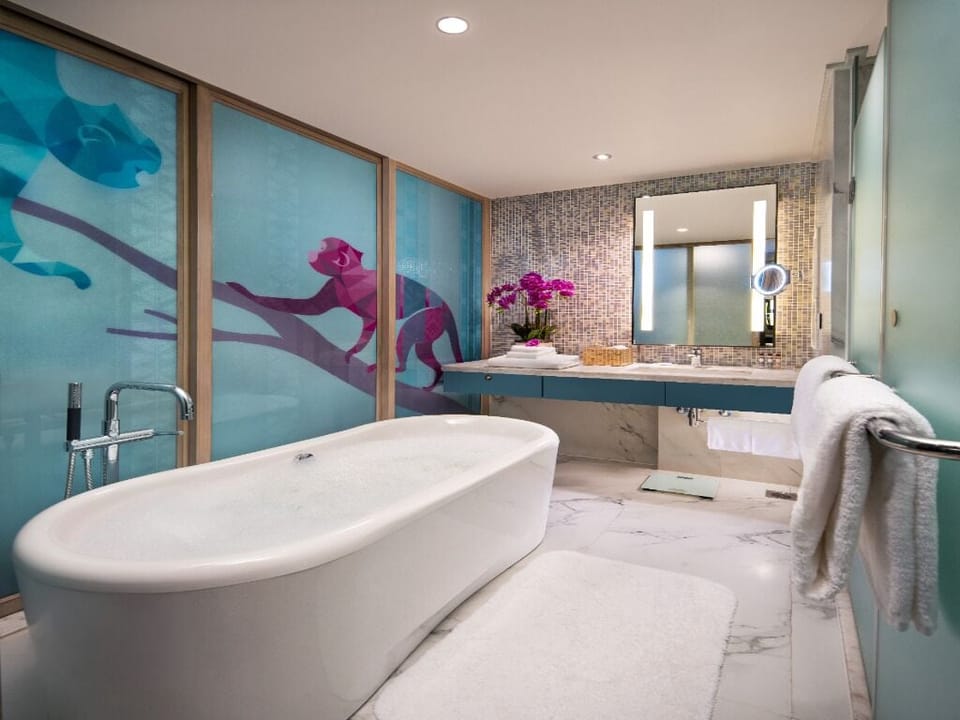 Separate tub and shower, free toiletries, hair dryer, bathrobes