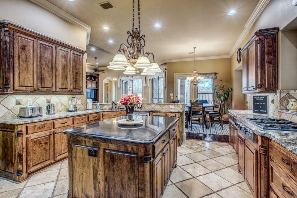 Also stainless steel cooking range, double ovens, fridge, and microwave