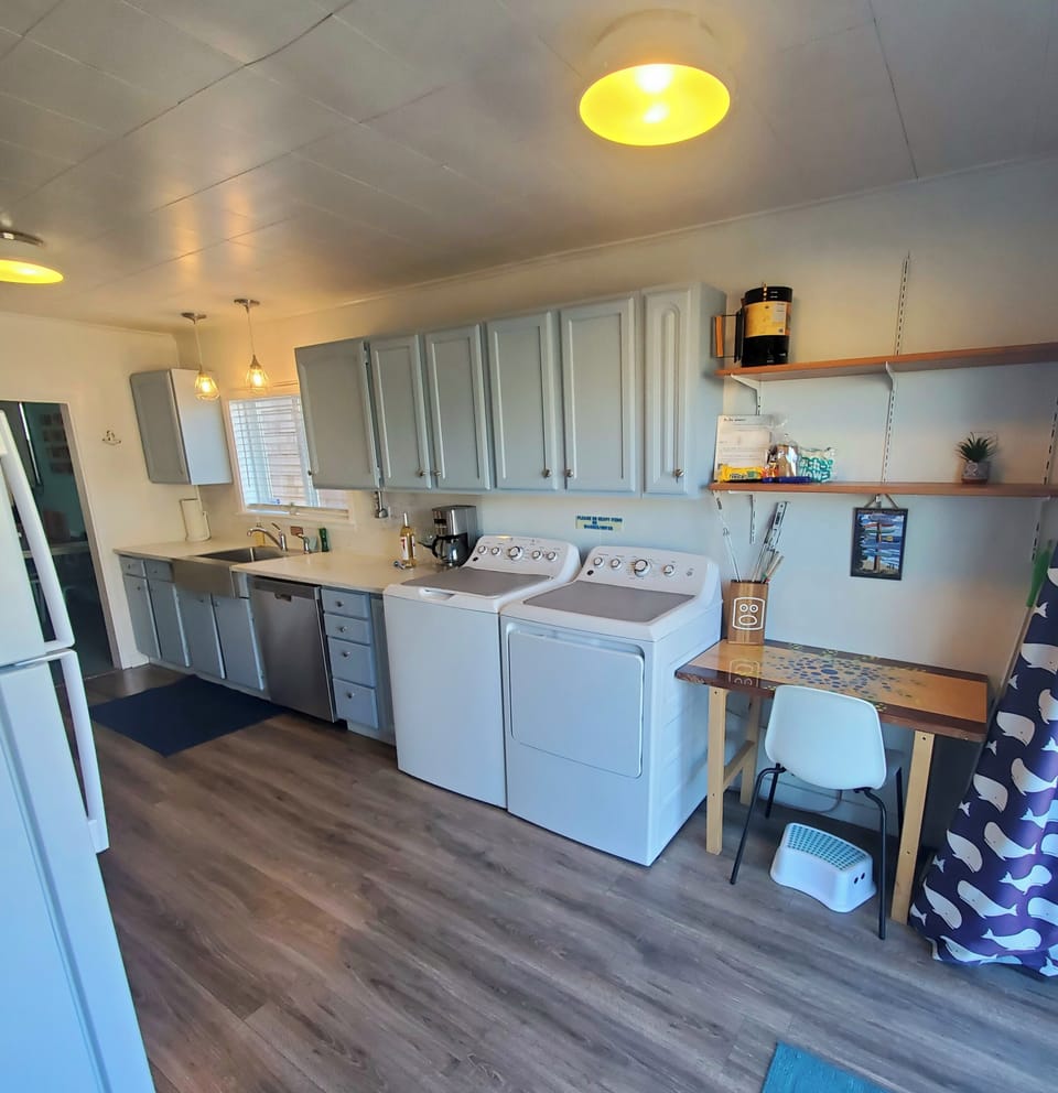 Full size fridge, Washer & Dryer w/detergent provided & workstation.