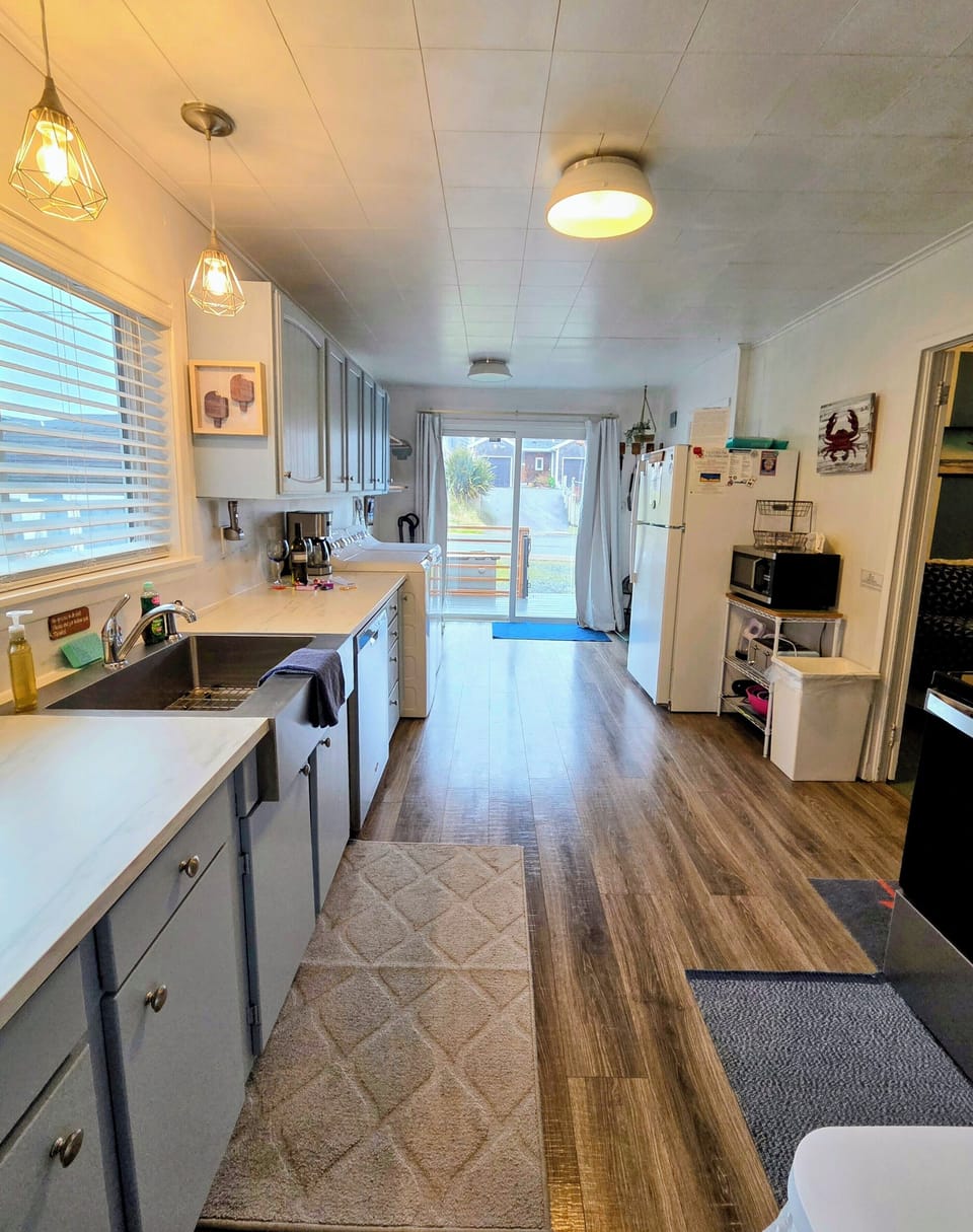 Updated kitchen w/New SS Dishwasher, Oven, Microwave, Full size Fridge, Washer & Dryer. Fully stocked for cooking meals, baking cakes & cupcakes