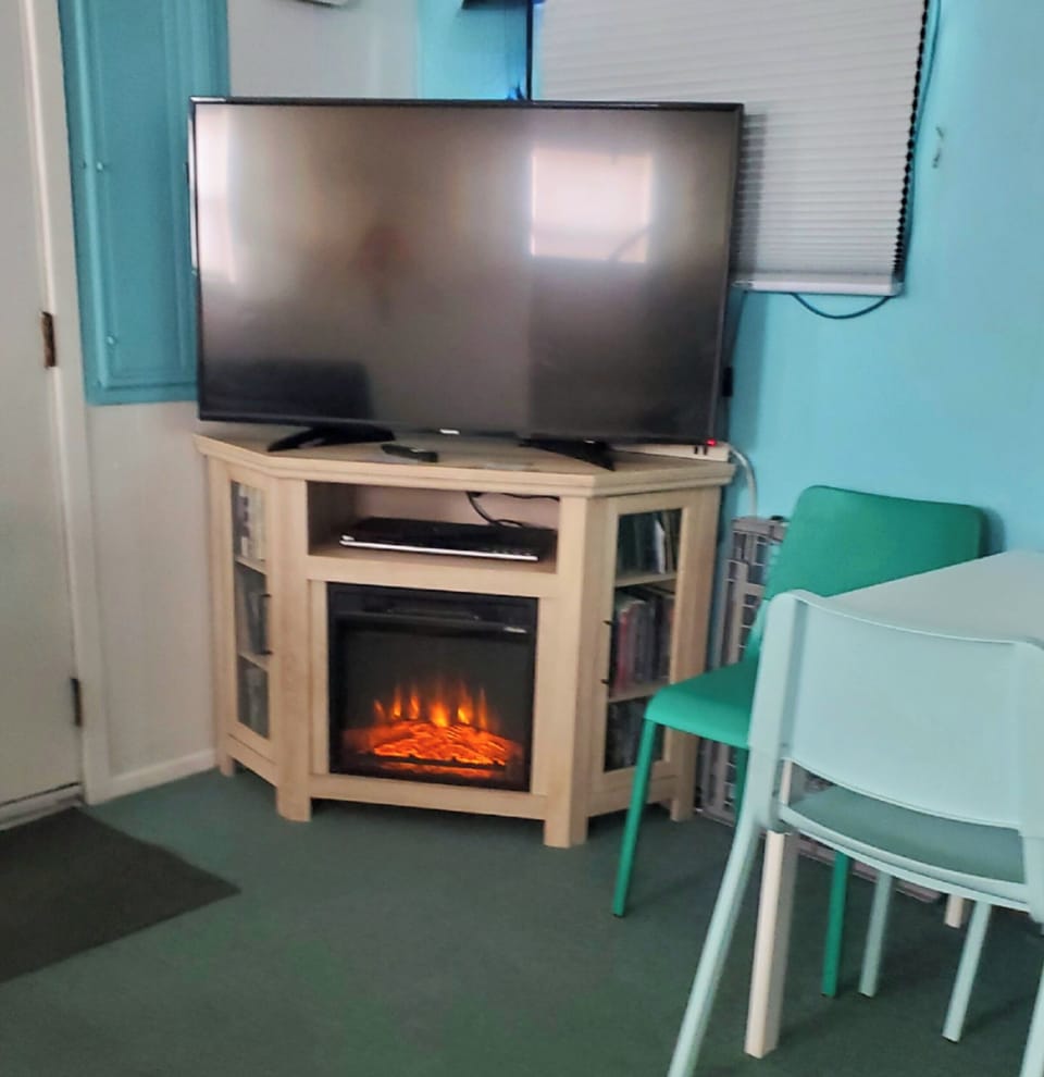 Cozy living room fireplace to warm up to on chilly nights. 