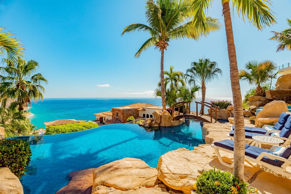 Patio with infinity edge pool and ocean view
