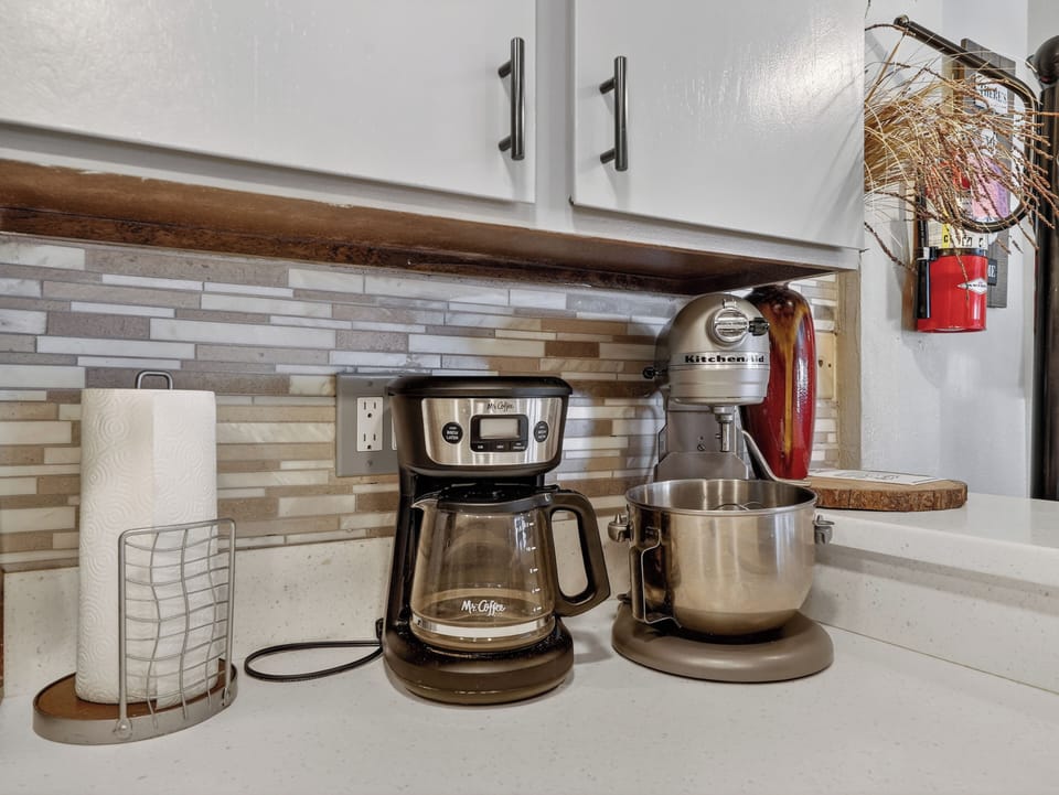Your fully equipped kitchen features premium appliances including a KitchenAid stand mixer and coffee maker for all your culinary adventures.