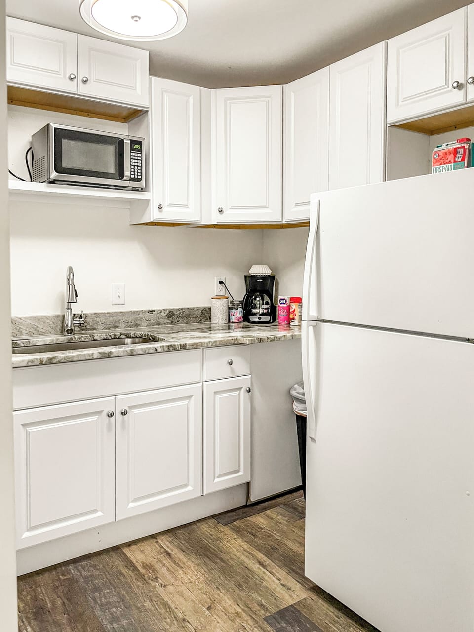 Full kitchen with drip coffee maker and coffee provided