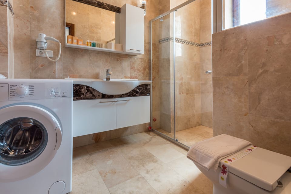 Suite, Sea View | Bathroom | Shower, free toiletries, hair dryer, slippers