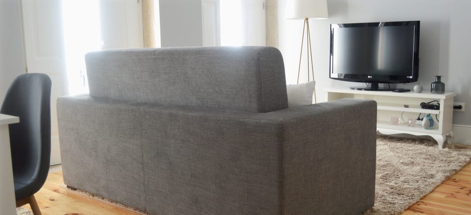 Apartment, 1 Bedroom | Living room | Flat-screen TV