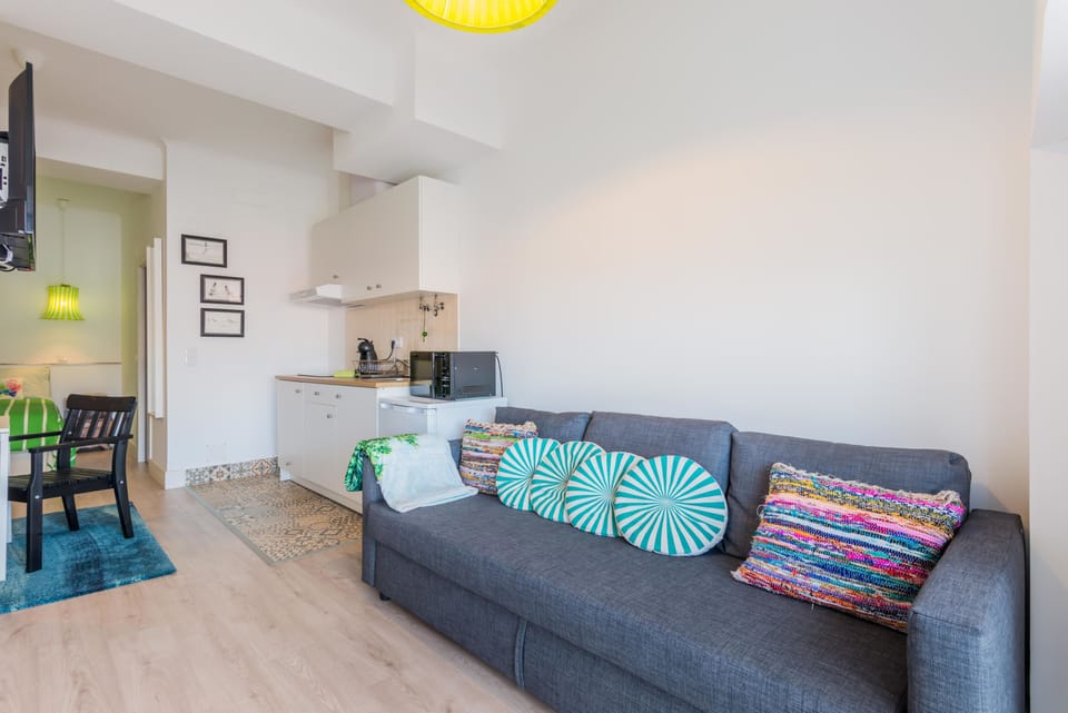 Panoramic Apartment, City View | Living area | Flat-screen TV