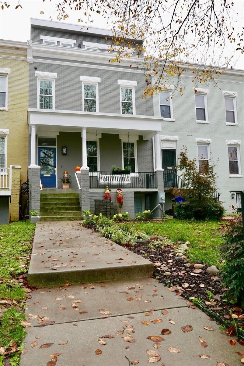 Entrance is to the right of the main house