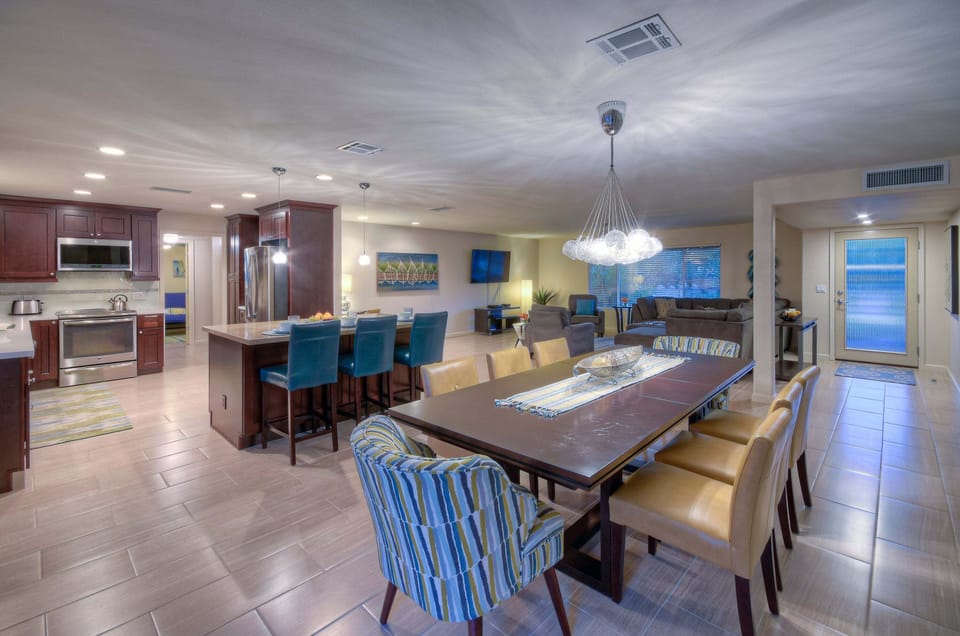 Open floor plan includes elegant bar seating plus a comfortable dining area for casual and formal meals.