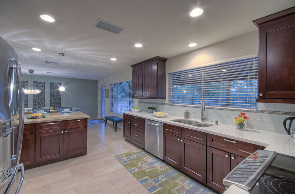 Impressive features of the remodeled kitchen include granite counters and stainless steel appliances.