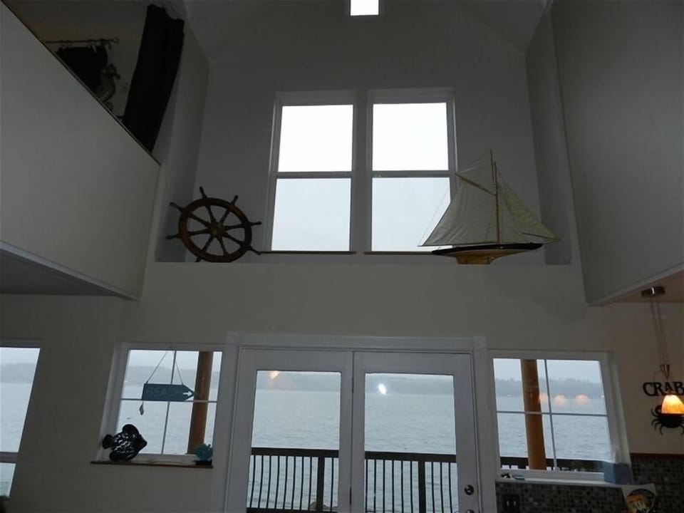 Center of house is totally open, 24 ft ceiling.  Master loft on left.