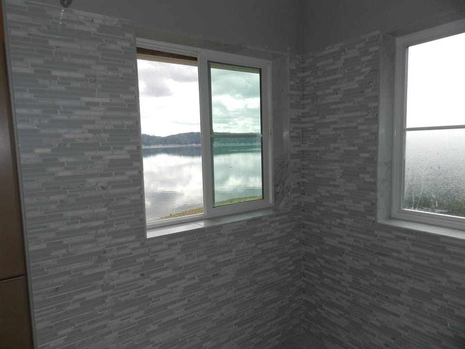 View of the Canal from the shower and tub. New marble and glass mosaic tile!