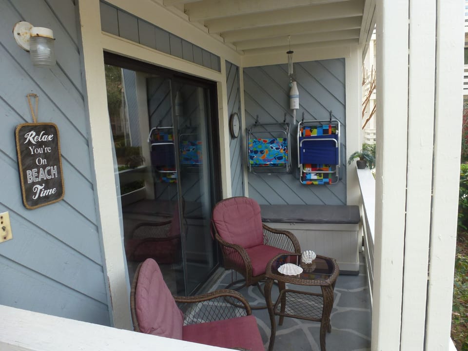 Our balcony with outdoor Table/chair for two.  Beach chairs and toy box.