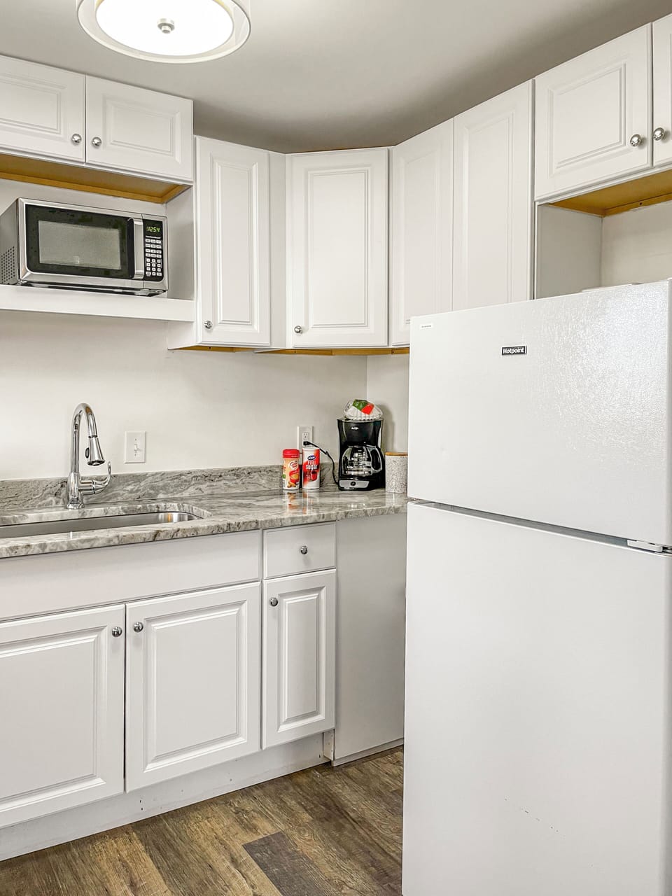 Full kitchen with drip coffee maker and coffee provided