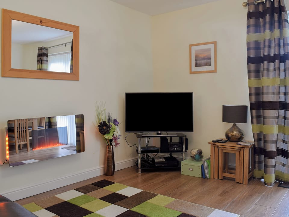 Cosy living room | 18 Elm Court - Greta Grove Apartments, Keswick