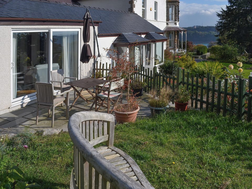 Lovely sitting out area with commanding views over the countryside | Haulfryn Cottage, Llandegfan, near Menai Bridge