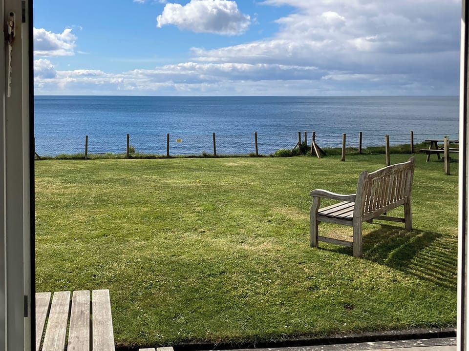 View from the door over the garden to the sea | Coastguard Cottage, Downderry, near Looe