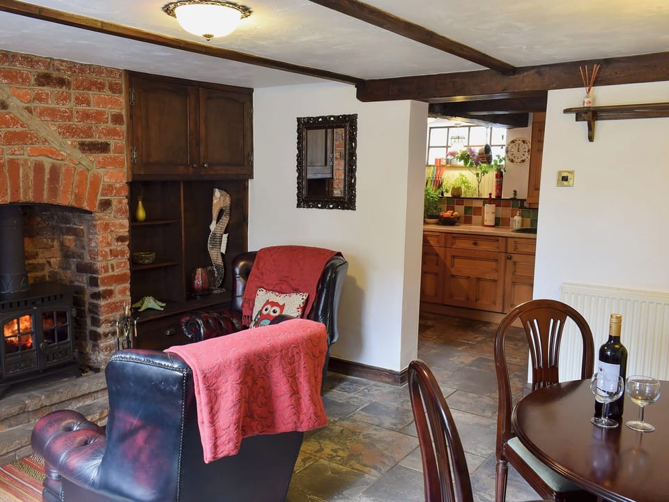 Dining room with sitting area leading to kitchen | Hope Cottage, Whitby