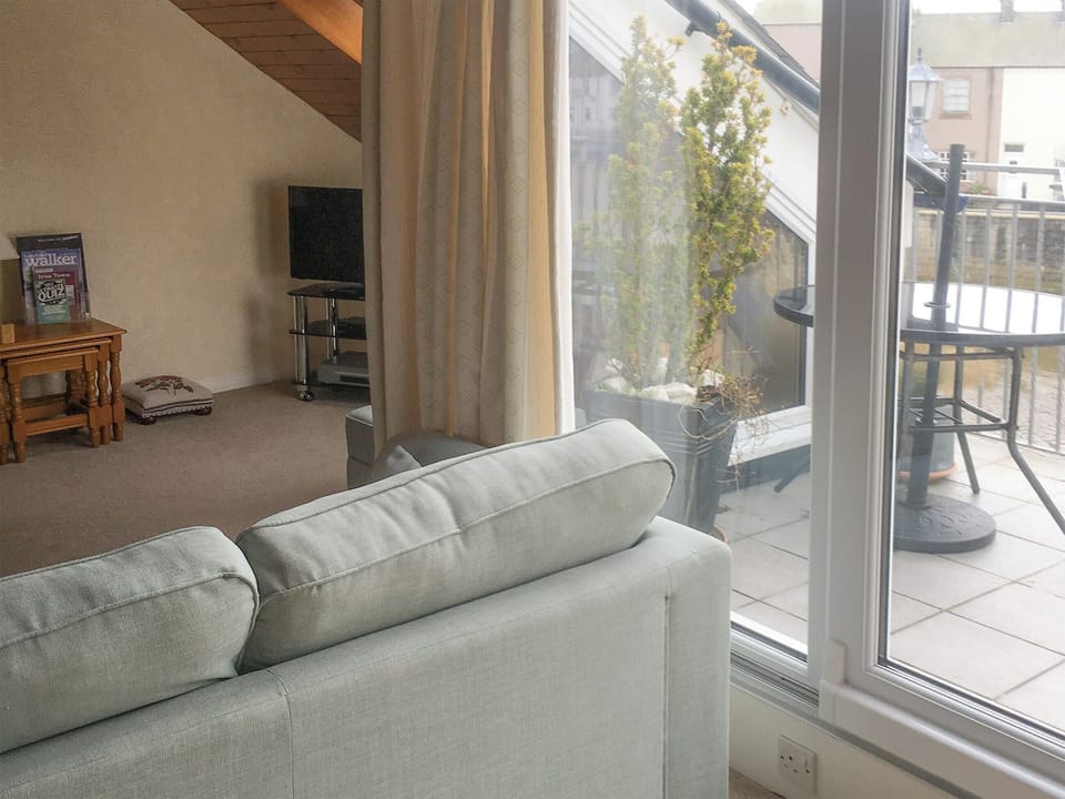 Airy living room with access to the balcony | Harbour Cottage, Haverigg, near Millom