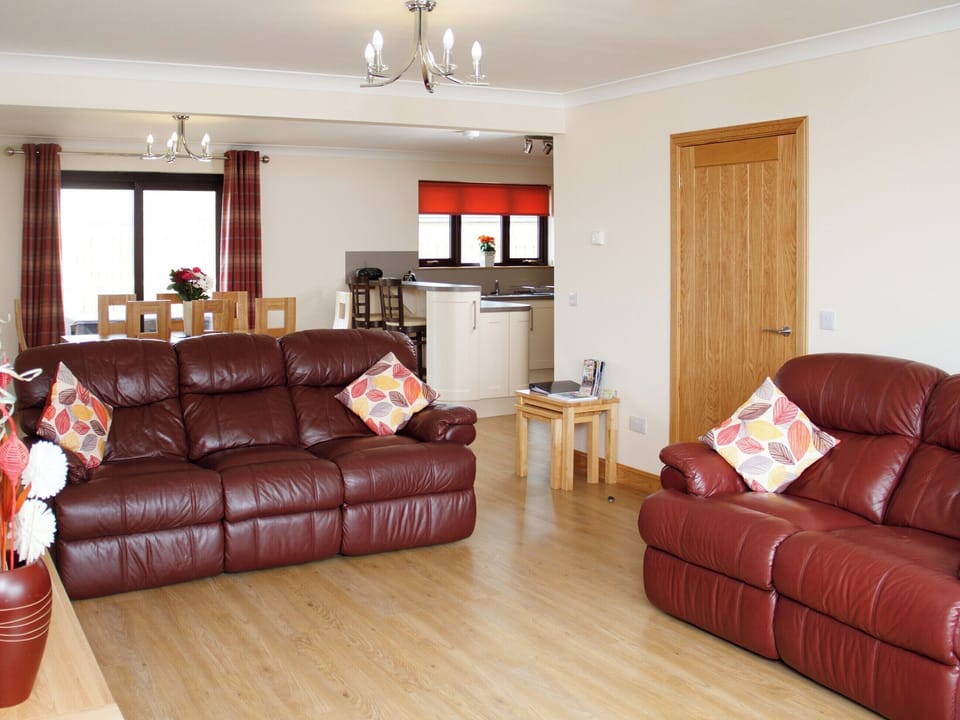 Airy living area looking towards the dining and kitchen zones | Seascape - Seascape Cottages, Southerness, near Dumfries