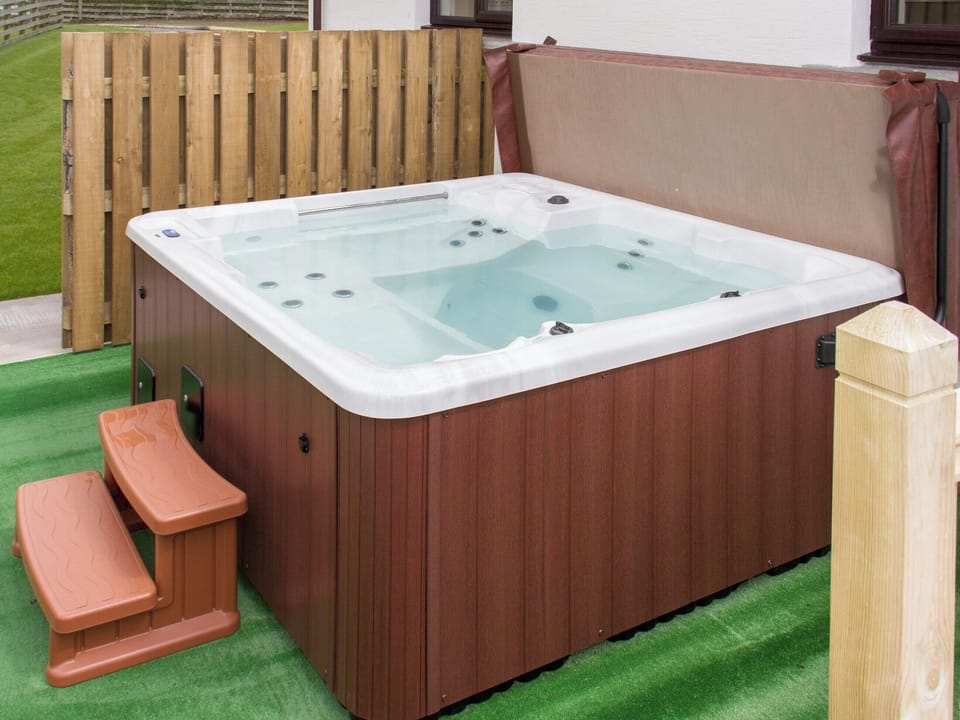 Relax in the luxurious hot-tub | Seascape - Seascape Cottages, Southerness, near Dumfries