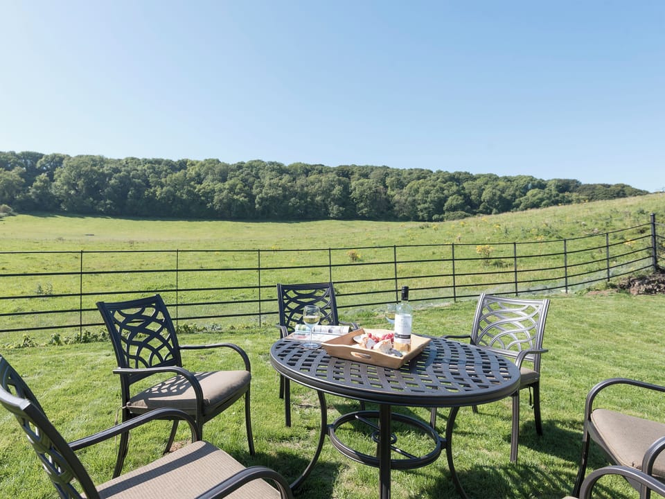 Outdoor furniture in garden | Property 1 - Rew Farm Barns, Ventnor