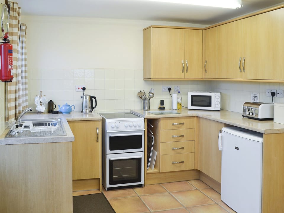 Well-appointed kitchen | The Gatehouse, Aberffraw, Anglesey