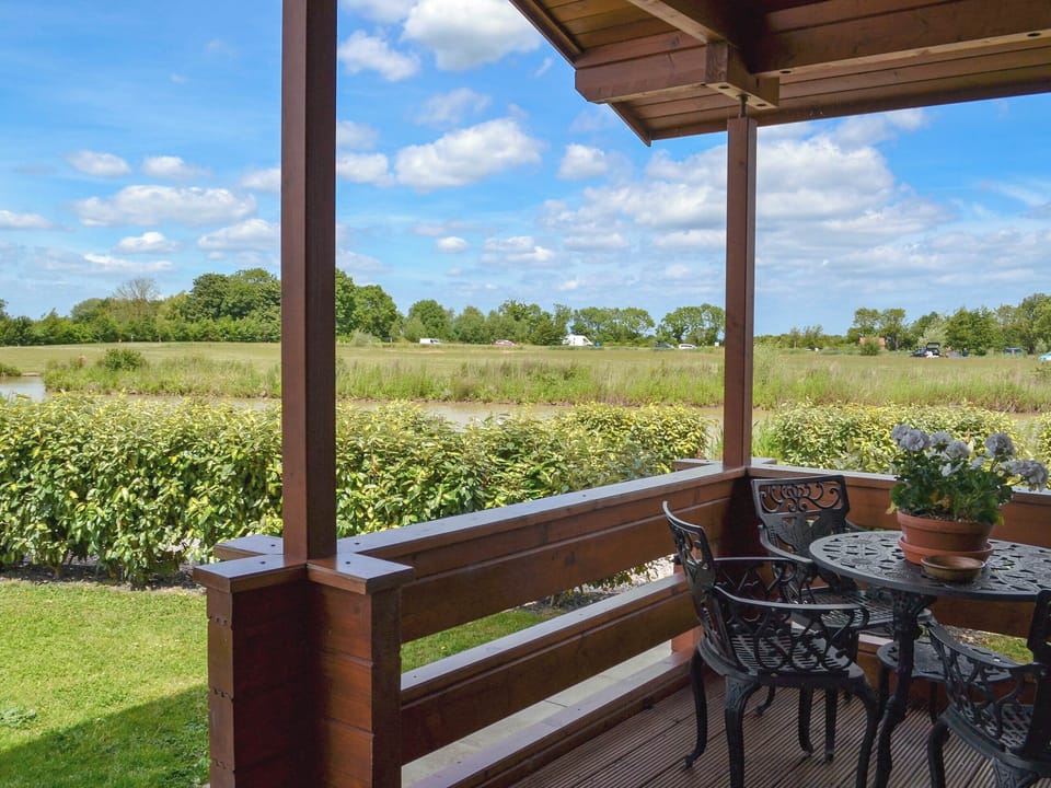 Sitting out area on the decking | Hawthorn Lodge, Bulrush Lodge - Faulkers Lakes, Burgh le Marsh, near Skegness