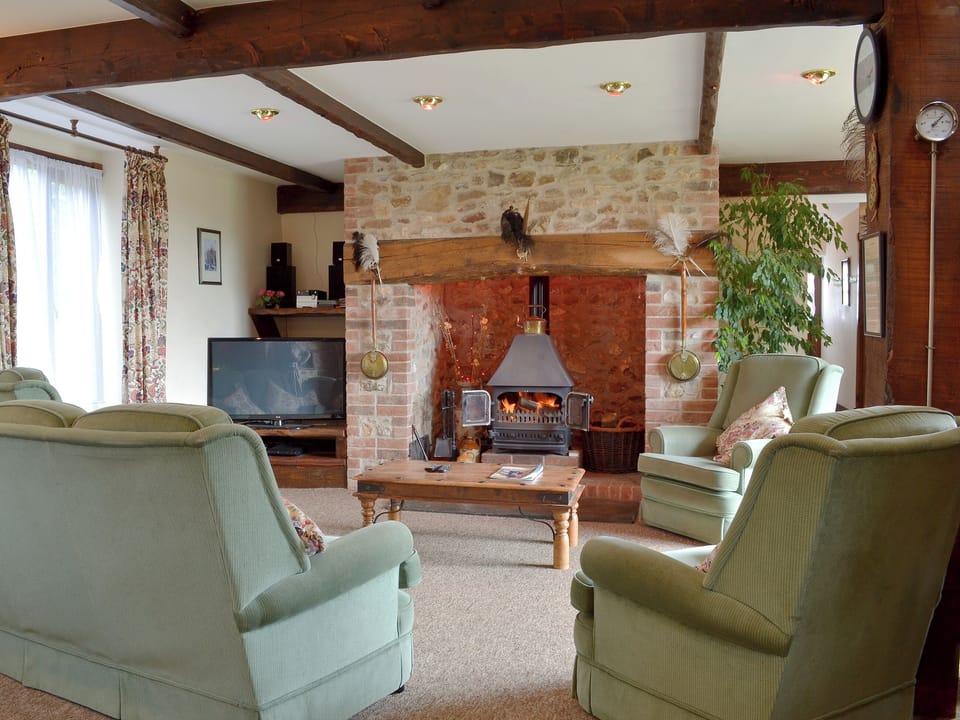 Cosy living area with woodburner | The Granary, Colyford, near Seaton