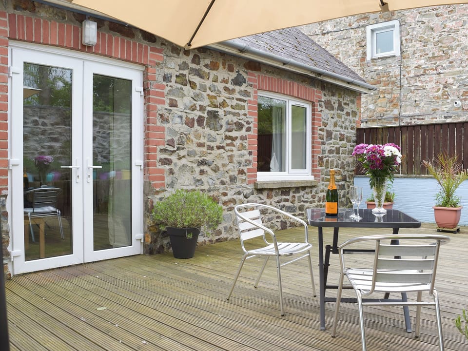French door access to the decked patio area | Llwynbedw, St Dogmaels, near Cardigan