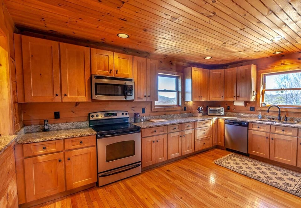 Kitchen with Custom Shaker-Style Cabinets and Wood Floors