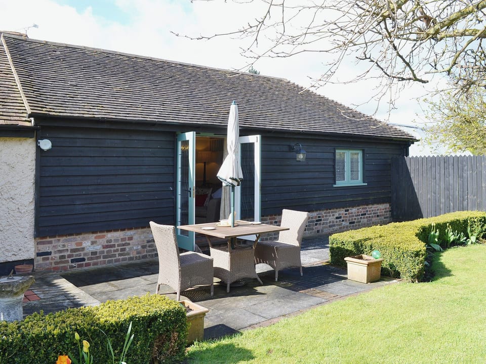 The patio makes a great place for sitting out in the fresh air | The Stables - Canterbury Cottages, Shatterling, near Canterbury 