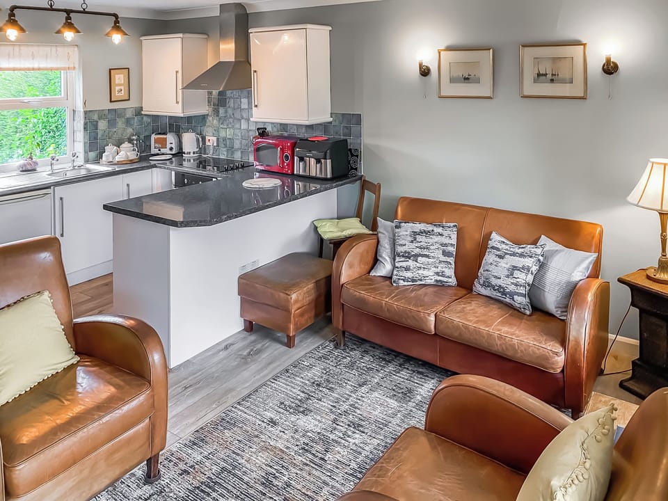Open plan living area and kitchen | Overland Cottage, Holt